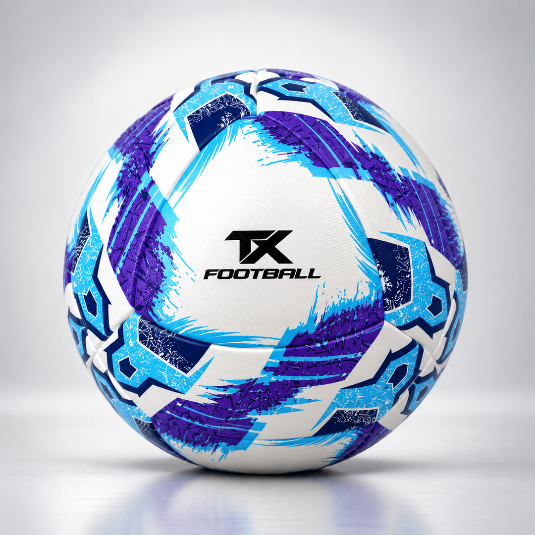 A white soccer ball with blue and purple geometric patterns and a black 'TX FOOTBALL' logo in the center, photographed on a light gray studio background.
